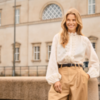 Crèmekleurige Saint Tropez blouse met broderie anglaise, lange mouwen en ruffle-detail aan de knoopsluiting.
