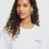 Wit oversized ICHI T-shirt van katoen met kleine Sun Kissed print op de borst en grote blauwe print op de achterkant.