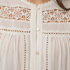 30515381_110605_360 Saint Tropez TullySZ witte katoenen blouse met opengewerkte details en lange gepofte mouwen.